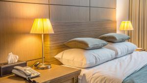 Postel nebo postele na pokoji v ubytování Venezia Hotel
