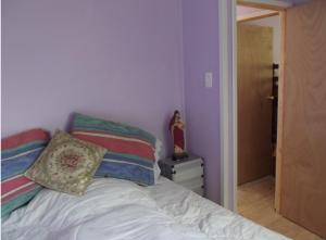 Postel nebo postele na pokoji v ubytování Cabaña Full Guanaqueros