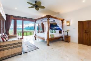 Champaca Luxury Villas Ubud客房内的一张或多张床位