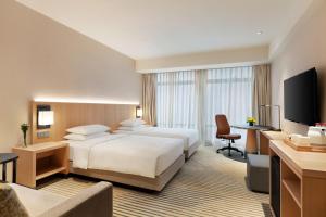 TV a/nebo společenská místnost v ubytování Hyatt Place Chengdu Pebble Walk