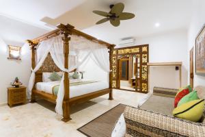 Champaca Luxury Villas Ubud客房内的一张或多张床位