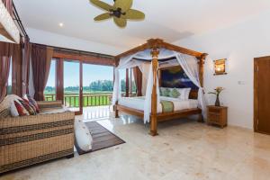Champaca Luxury Villas Ubud客房内的一张或多张床位