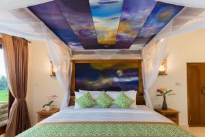 Champaca Luxury Villas Ubud客房内的一张或多张床位