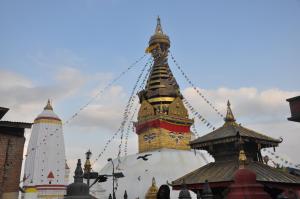 Un edificio con una torre con un orologio sopra di STUPA VIEW INN a Kathmandu