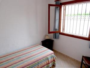 Un pat sau paturi într-o cameră la Cabañas 59