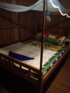 Säng eller sängar i ett rum på Bee Bee's Chalets home stay and trekking