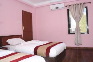 Postel nebo postele na pokoji v ubytování Sitapaila Home Stay and Apartment