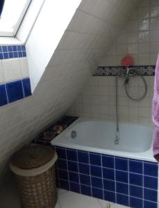 a bathroom with a bath tub in a attic at Bajka in Gdańsk