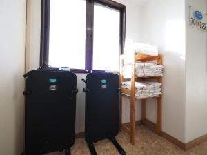 Postel nebo postele na pokoji v ubytování Sky Heart Hotel Shimonoseki