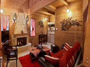 a living room with a couch and a fireplace at Feggarognemata Suites in Ano Trikala