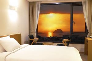 Postel nebo postele na pokoji v ubytování Mstay Hotel