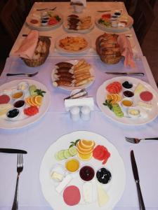 a table topped with plates of food at Tekeli Konaklari in Antalya