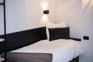 Postel nebo postele na pokoji v ubytování Hotel Carnac