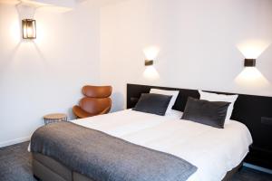 Postel nebo postele na pokoji v ubytování Hotel Carnac