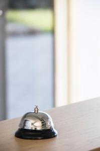 a bell sitting on top of a table at Apartments Balaska in Xiropigado