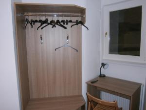 a room with a closet with a wooden door at Fanni Budapest Guesthouse in Budapest