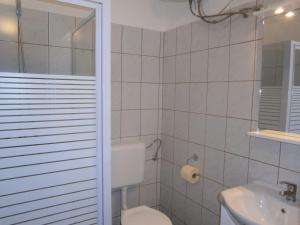 a bathroom with a toilet and a sink at Fanni Budapest Guesthouse in Budapest