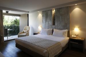Krevet ili kreveti u jedinici u okviru objekta Palmon Bay Hotel & Spa