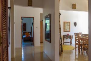 a hallway with a living room and a dining room at Magic Beach Villa in Kiwengwa