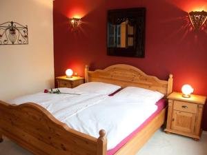 a bedroom with a wooden bed with two night stands at Ferienwohnungen Koller in Bodenmais