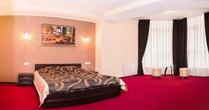 Postel nebo postele na pokoji v ubytování Mark Plaza Hotel