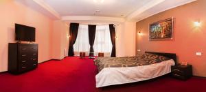 Postel nebo postele na pokoji v ubytování Mark Plaza Hotel