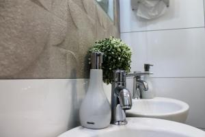 Koupelna v ubytování Garni Hotel 11tica DM + 36 fotografií