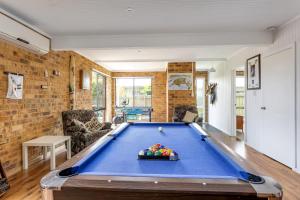 a living room with a pool table at Sany Views: 10min walk to beach in San Remo