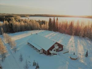 an aerial view of a barn in the snow at Valkeisen Loma in Ähtäri