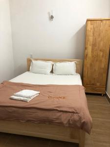 Postel nebo postele na pokoji v ubytování An Ngọc Linh Hotel
