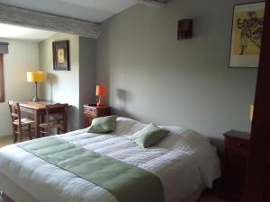 Postel nebo postele na pokoji v ubytování La Bastide de l'Oliveraie