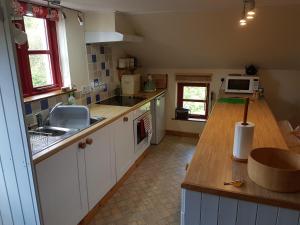 a kitchen with a sink and a counter top at Seren Loft - Cynghordy, Llandovery in Llandovery