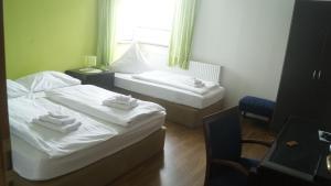 Posteľ alebo postele v izbe v ubytovaní Zum Landhaus Dannenbüttel