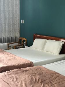 Postel nebo postele na pokoji v ubytování An Ngọc Linh Hotel