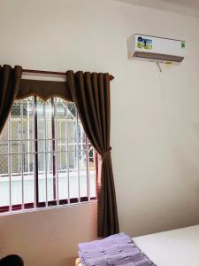 Postel nebo postele na pokoji v ubytování An Ngọc Linh Hotel