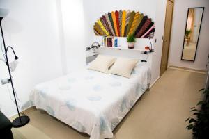 Posteľ alebo postele v izbe v ubytovaní Apartamentos RISCOS