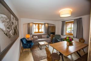 a living room with a couch and a table at Chalet Karin in Sankt Anton am Arlberg