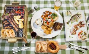 a table with plates of food on a table at St Raphael Resort in Limassol