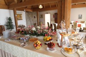 a table with fruit and other food on it at Hotel Boutique Il Castellino Relais in Vieste