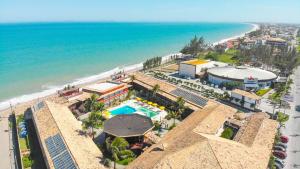 an aerial view of a resort and the beach at Hotel Vilarejo Praia in Rio das Ostras