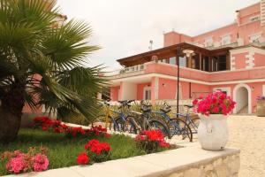 a group of bikes parked in front of a house at Hotel Boutique Il Castellino Relais in Vieste