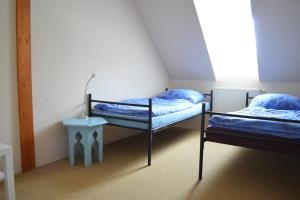 Posteľ alebo postele v izbe v ubytovaní Stará Fara
