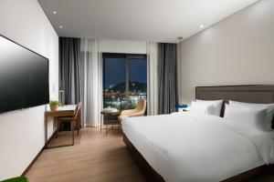 Voodi või voodid majutusasutuse N Bridge Hotel JEON JU toas