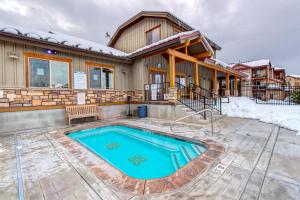 a house with a swimming pool in the yard at Bear Hollow Beauty in Park City