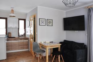 Kuchyňa alebo kuchynka v ubytovaní Apartamenty JSZI