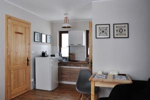 Kuchyňa alebo kuchynka v ubytovaní Apartamenty JSZI