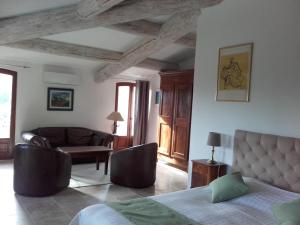 Postel nebo postele na pokoji v ubytování La Bastide de l'Oliveraie