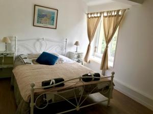 Postel nebo postele na pokoji v ubytování La Bichurie