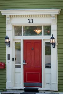 a red door on a house with the number at The Elizabeth Manor Guesthouse in St. John's