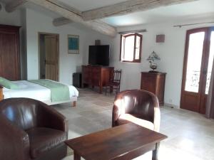 Postel nebo postele na pokoji v ubytování La Bastide de l'Oliveraie